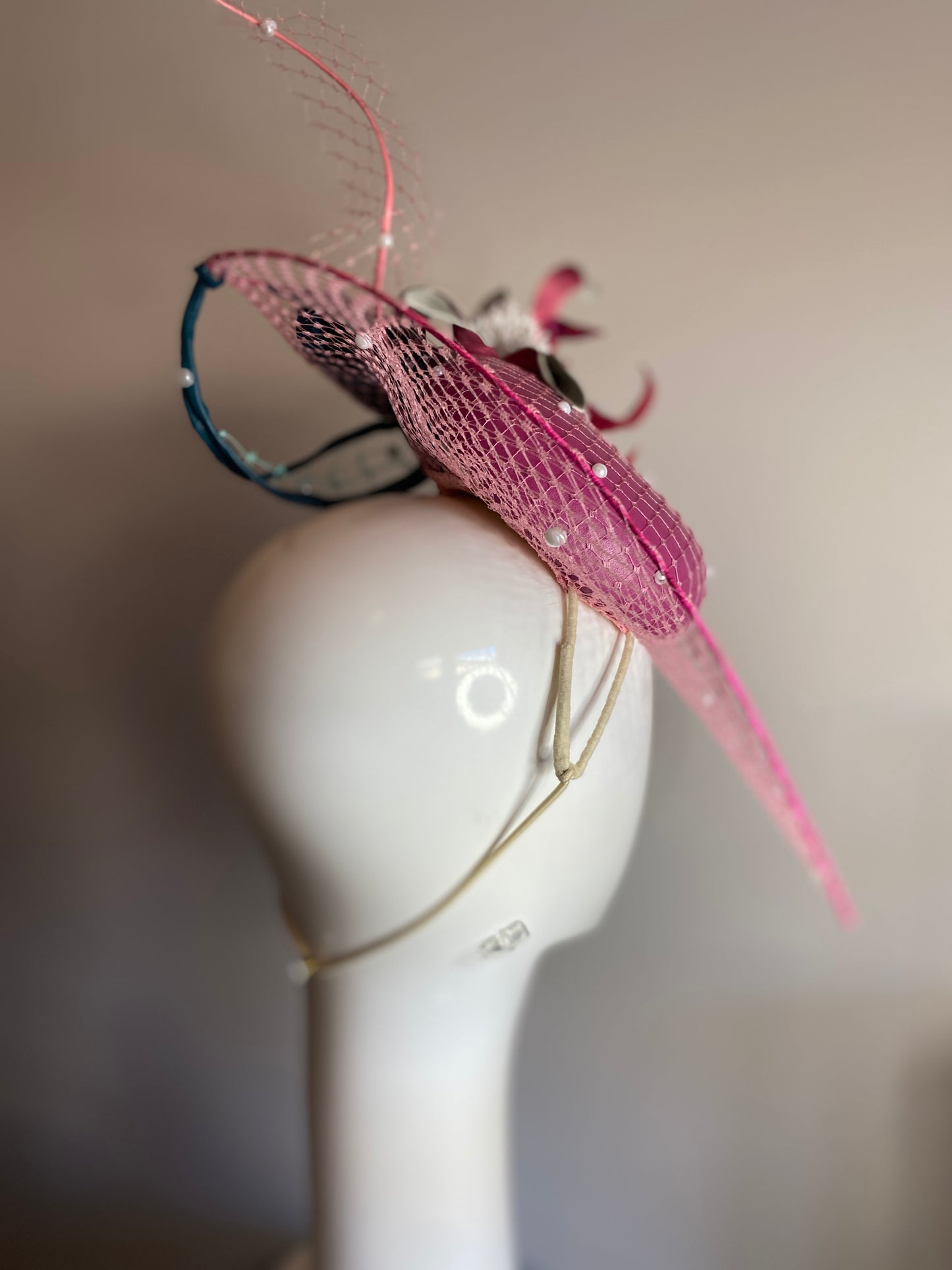 Magenta veiled brim button with leather flowers