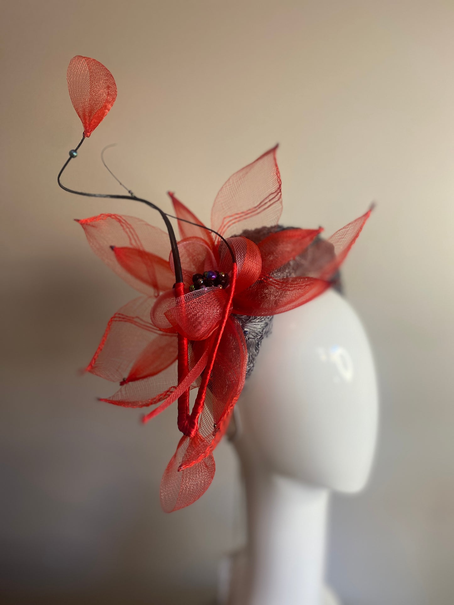 Grey straw bandeau with red flower