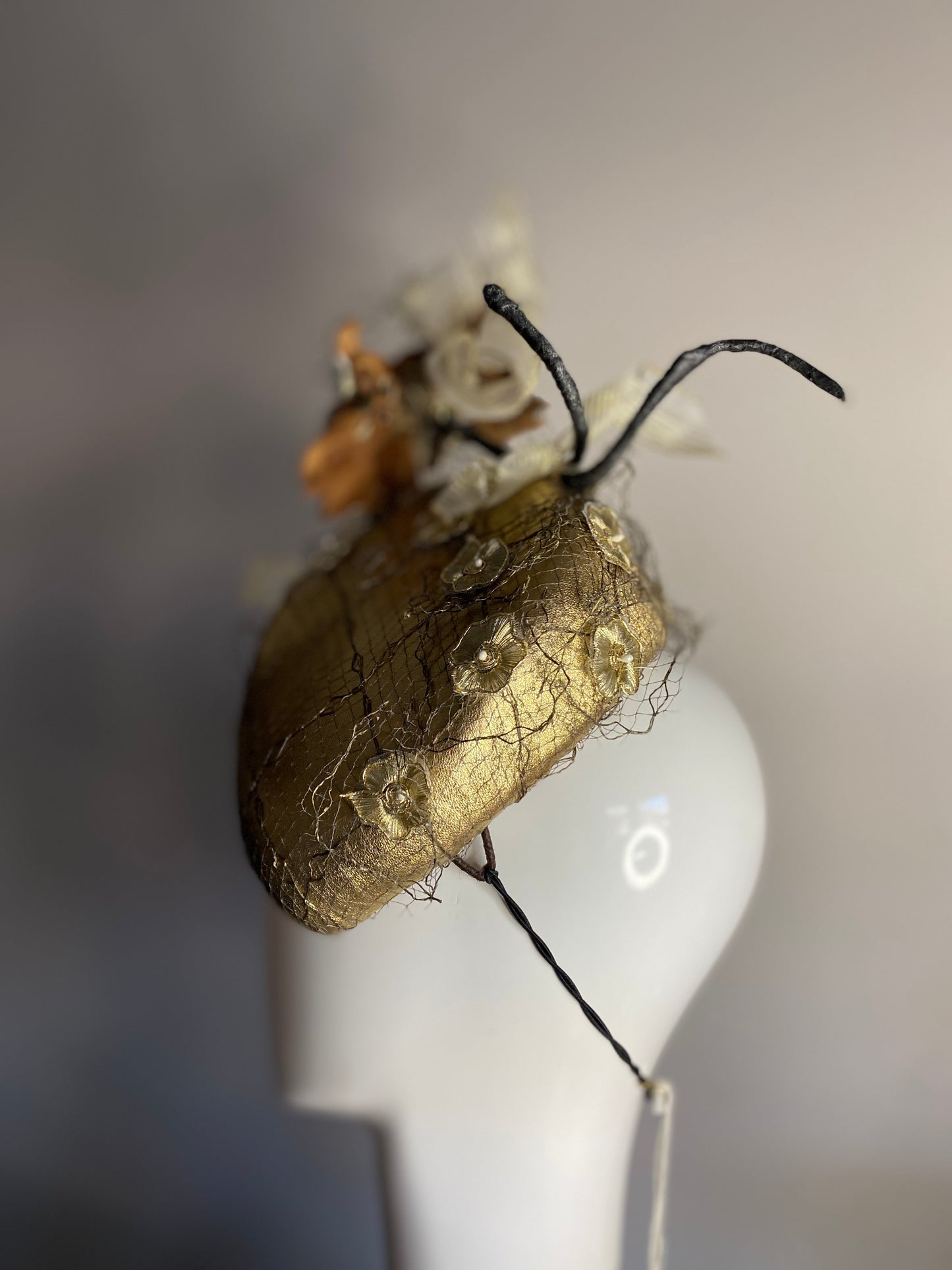 Gold percher with leather flowers