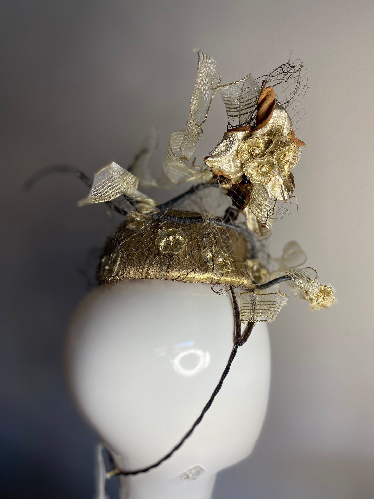 Gold percher with leather flowers