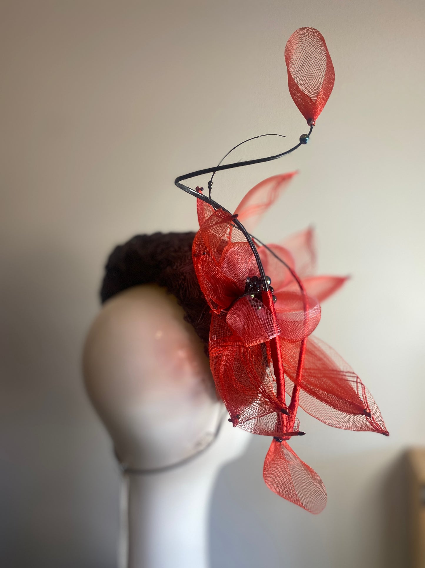 Grey straw bandeau with red flower