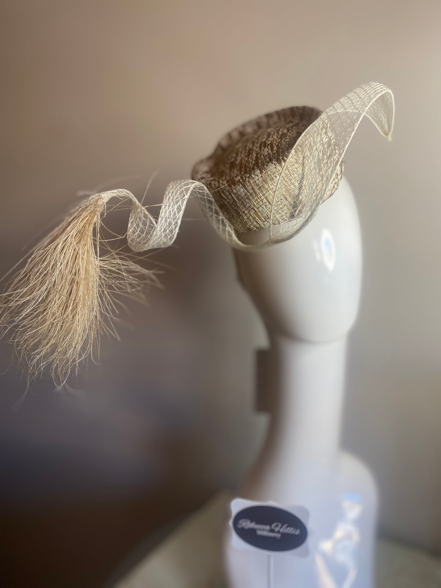 White and Gold straw button with feather plume