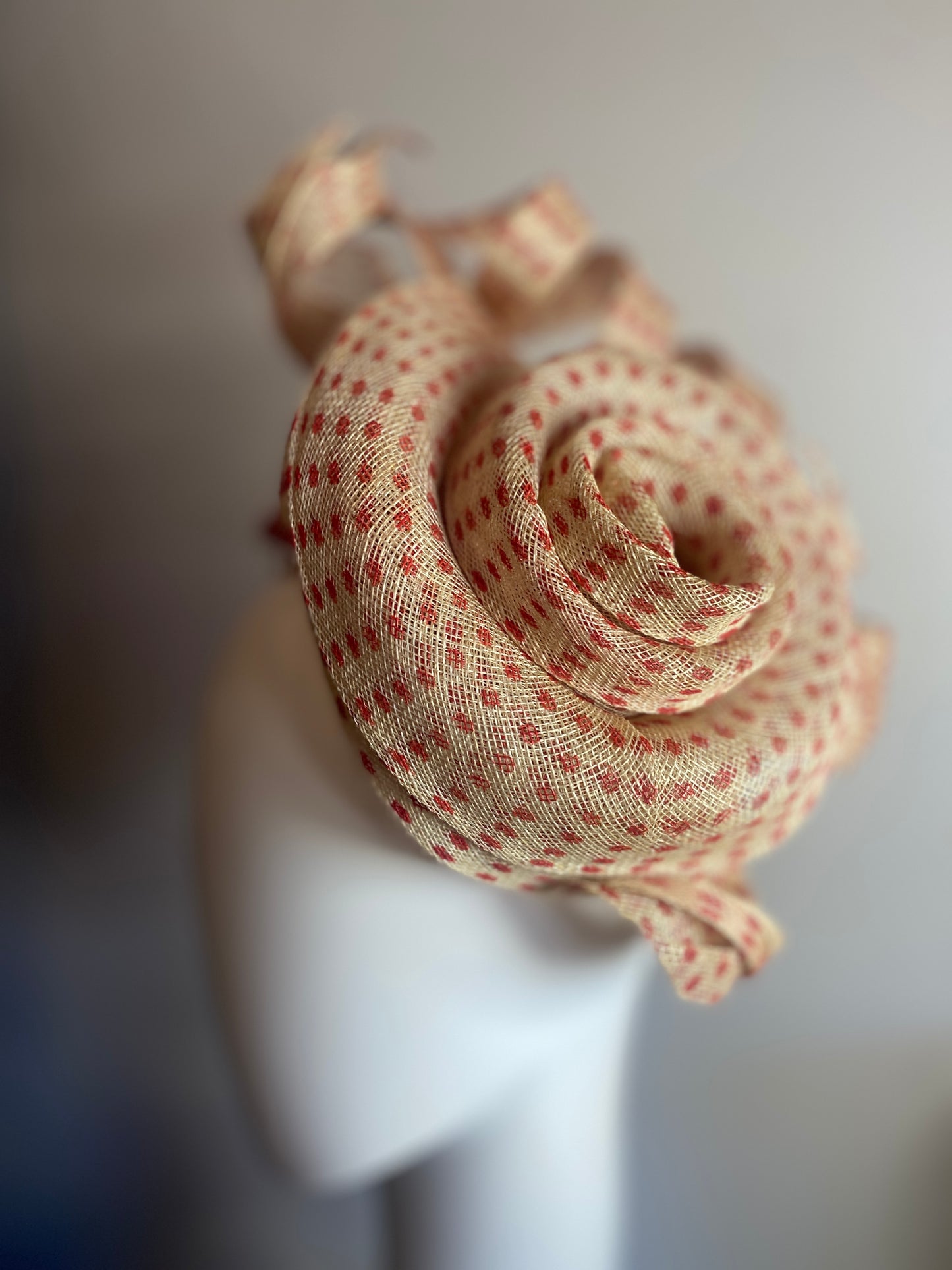 Red spotty sinamay swirl headpiece