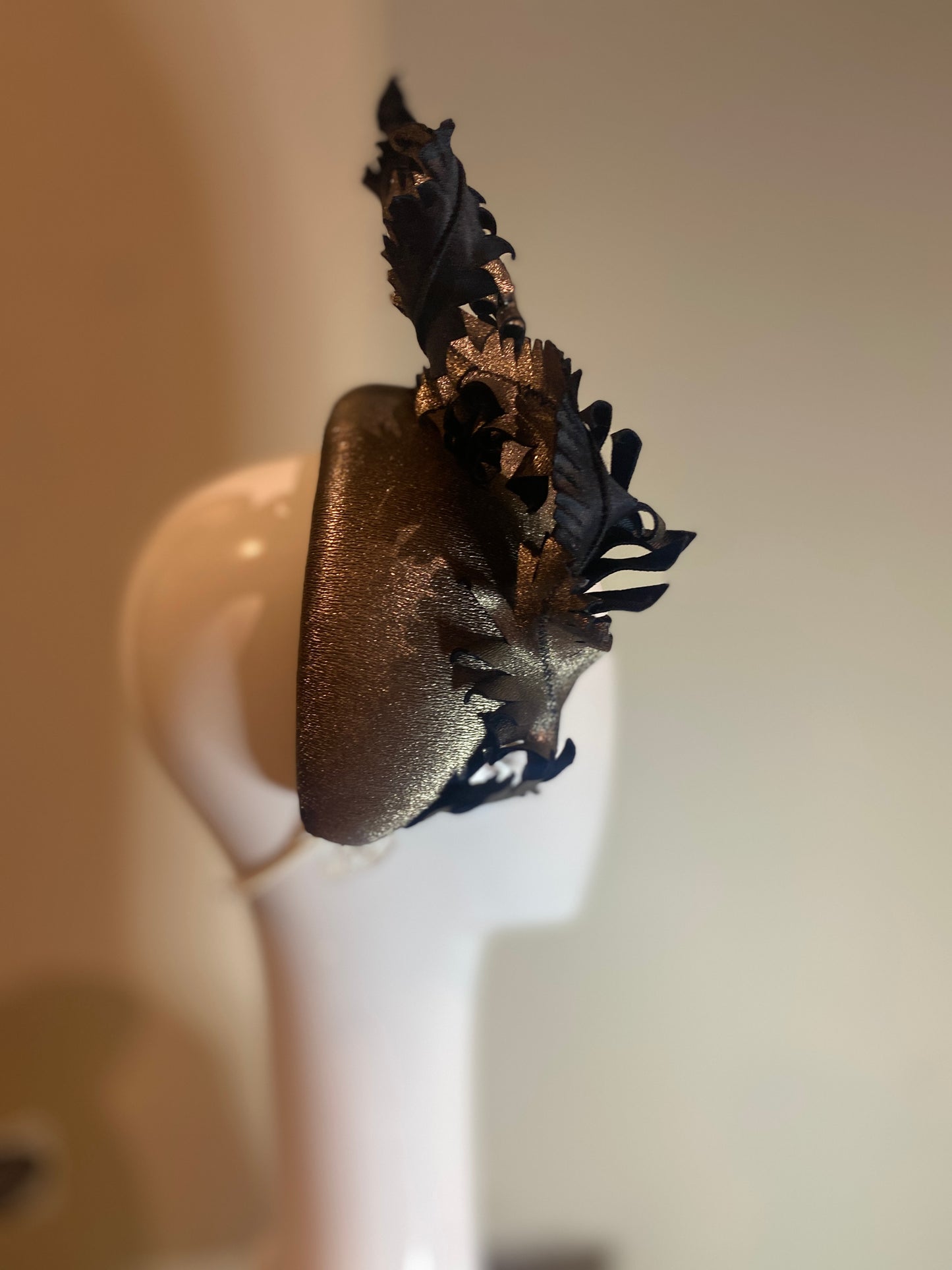 Metallic bandeau with twisted leather feathers