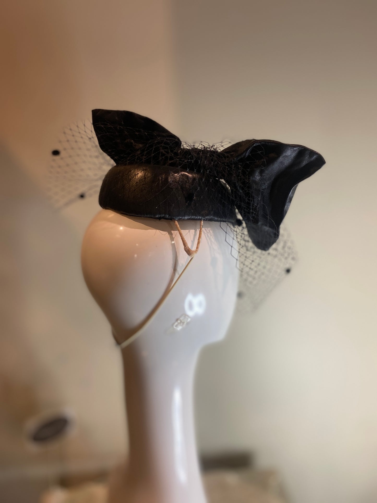 Black leather percher with bow