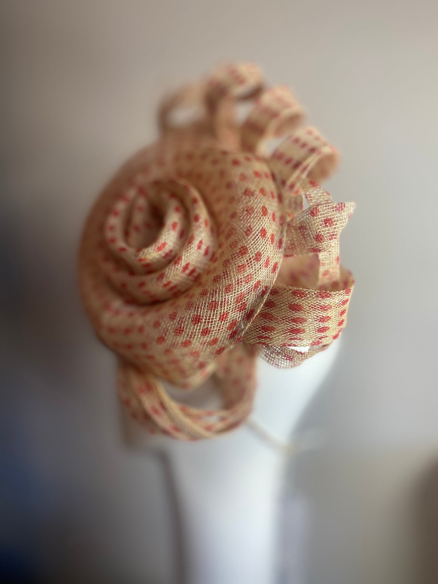 Red spotty sinamay swirl headpiece