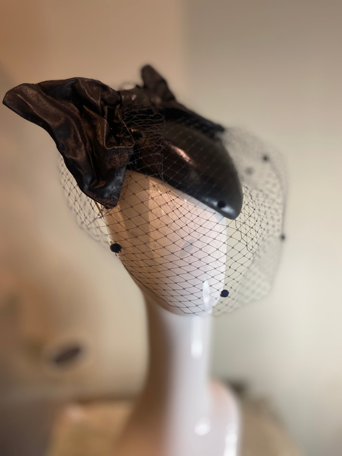 Black leather percher with bow