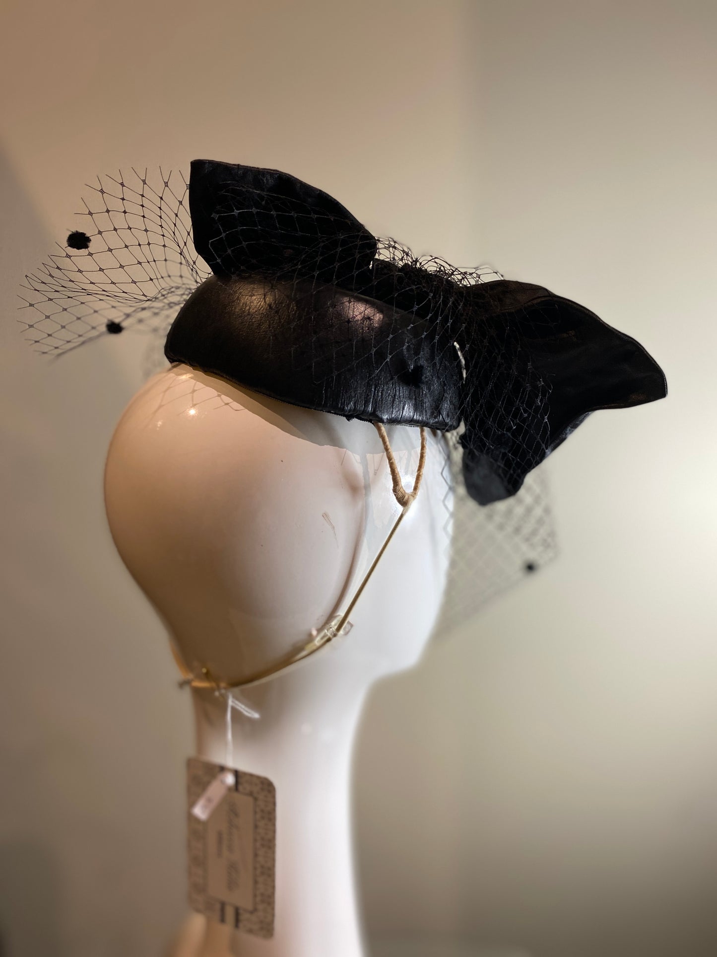 Black leather percher with stiffened bow