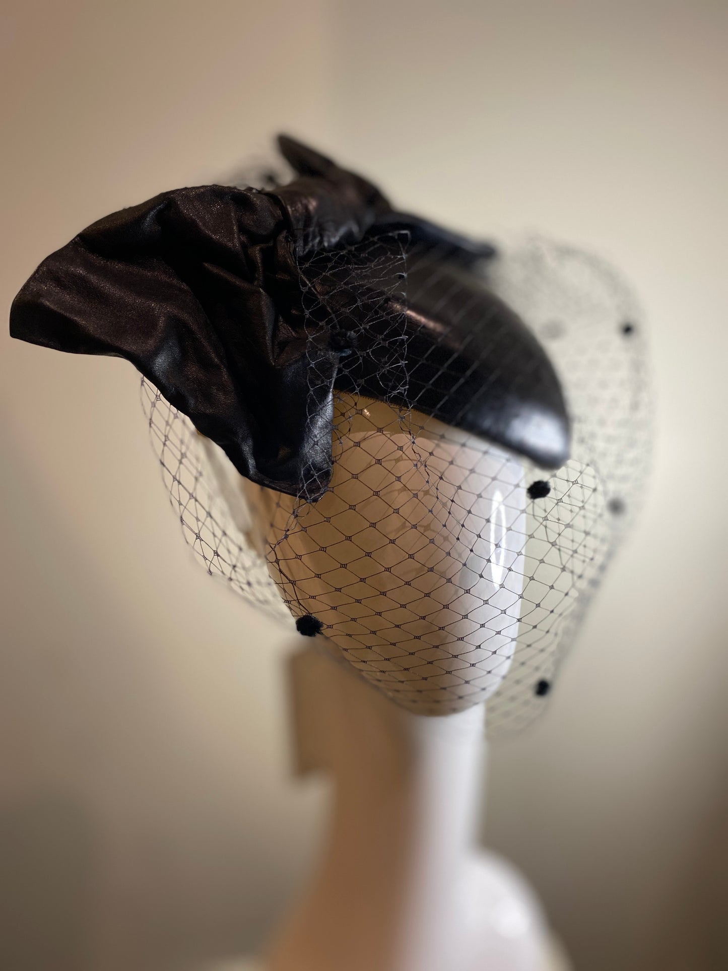 Black leather percher with stiffened bow