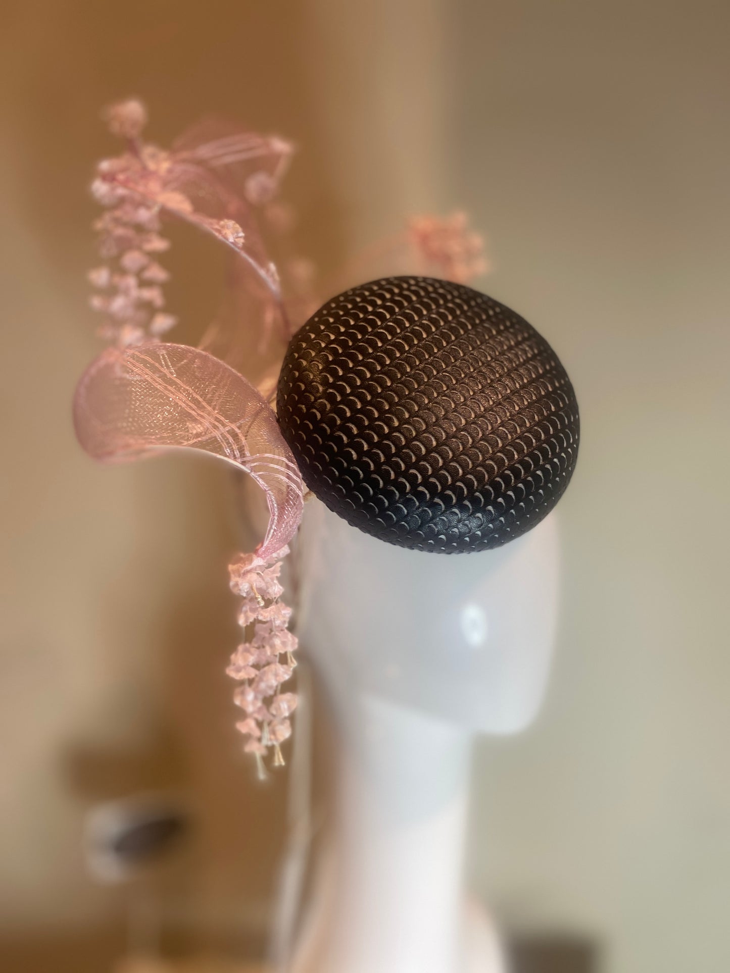 Black pleather button pillbox hat with pink crinoline swirl