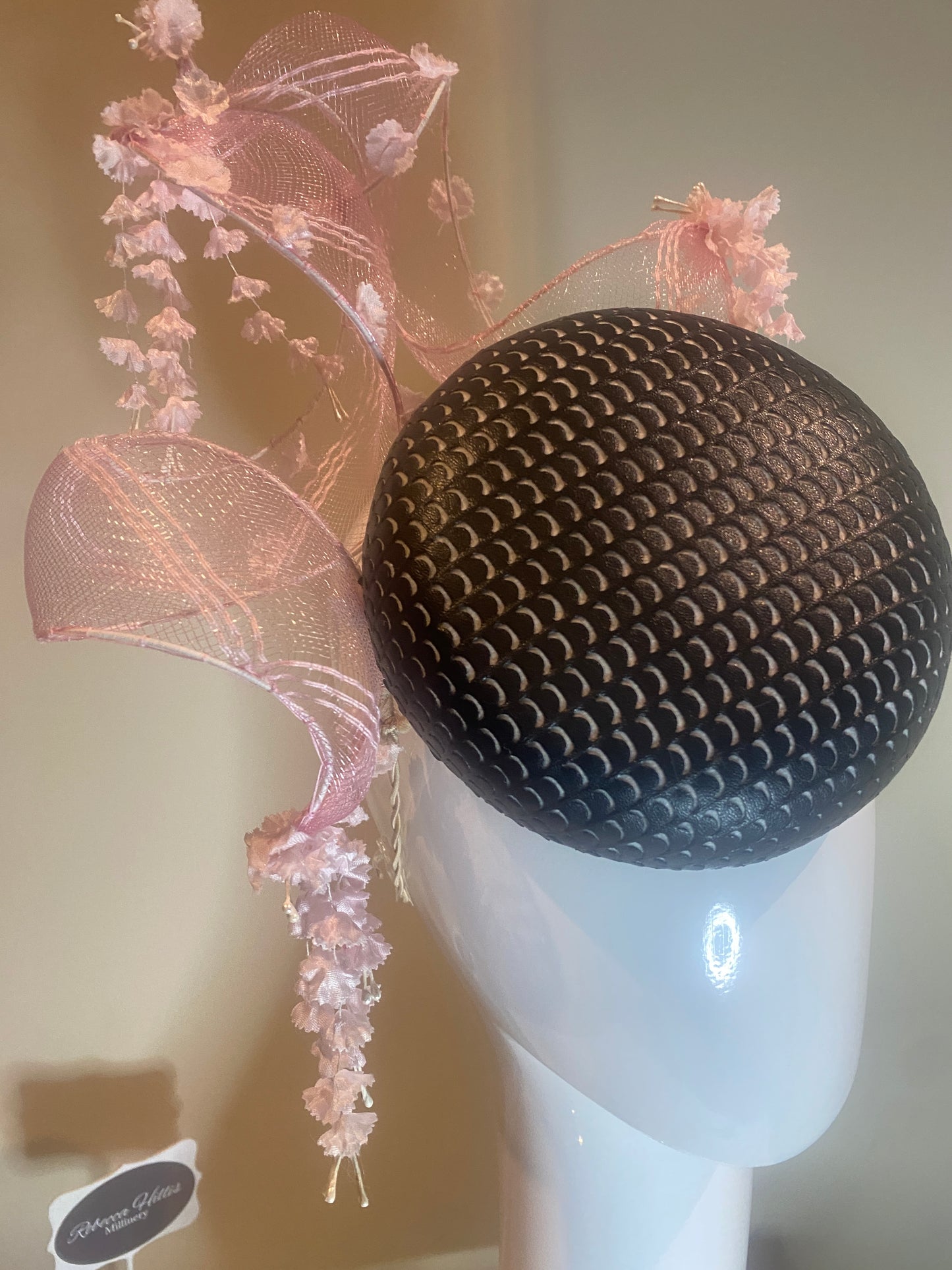 Black pleather button pillbox hat with pink crinoline swirl