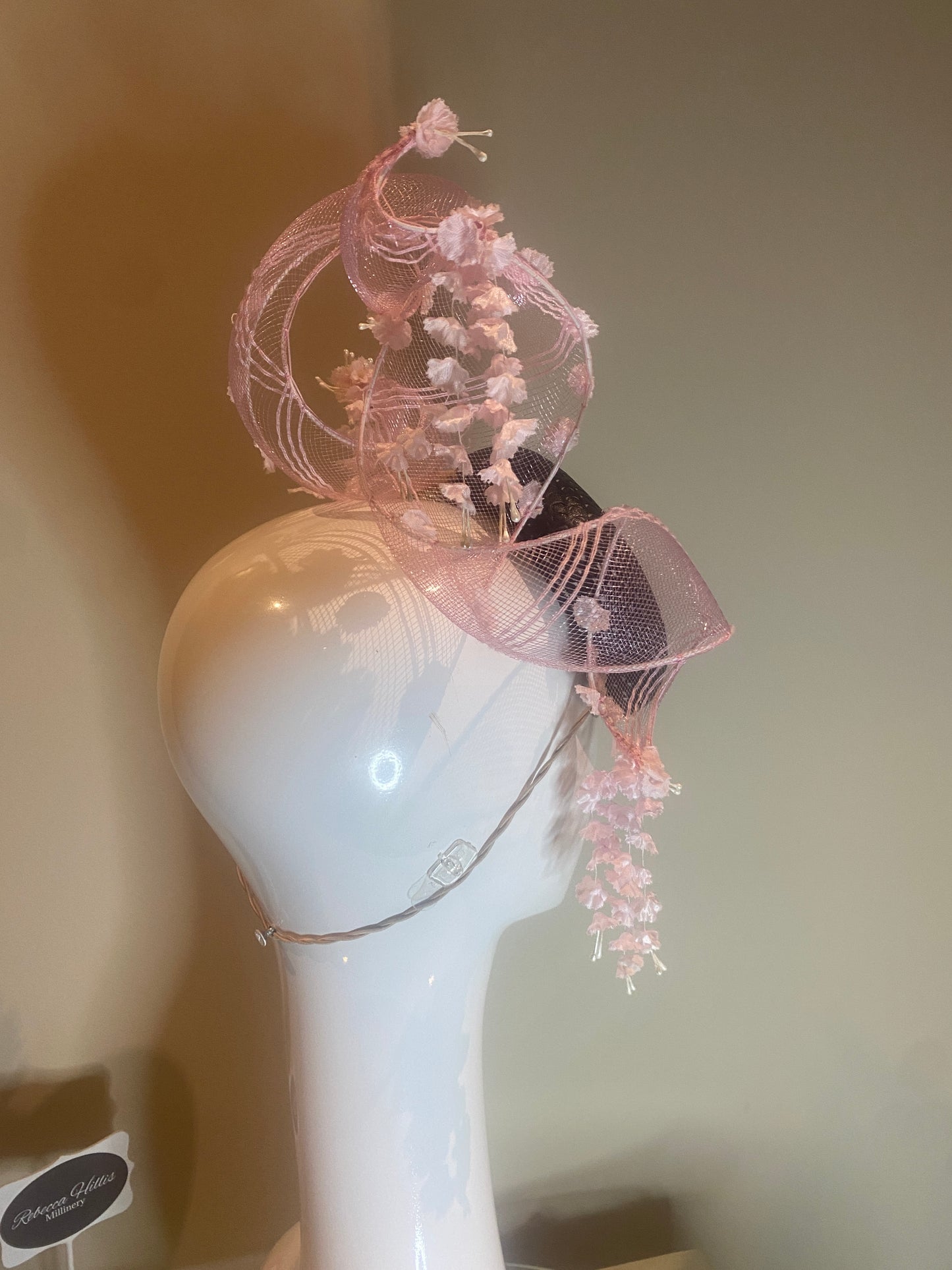 Black pleather button pillbox hat with pink crinoline swirl