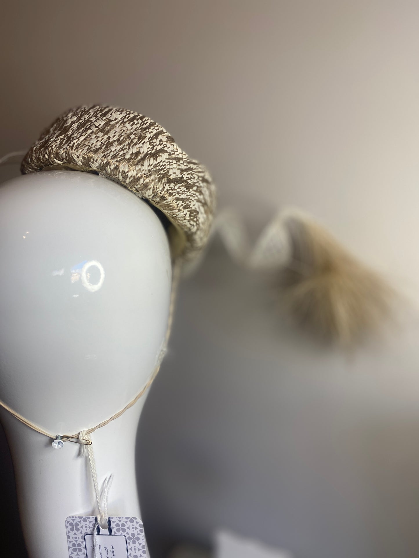 White and Gold straw button with feather plume