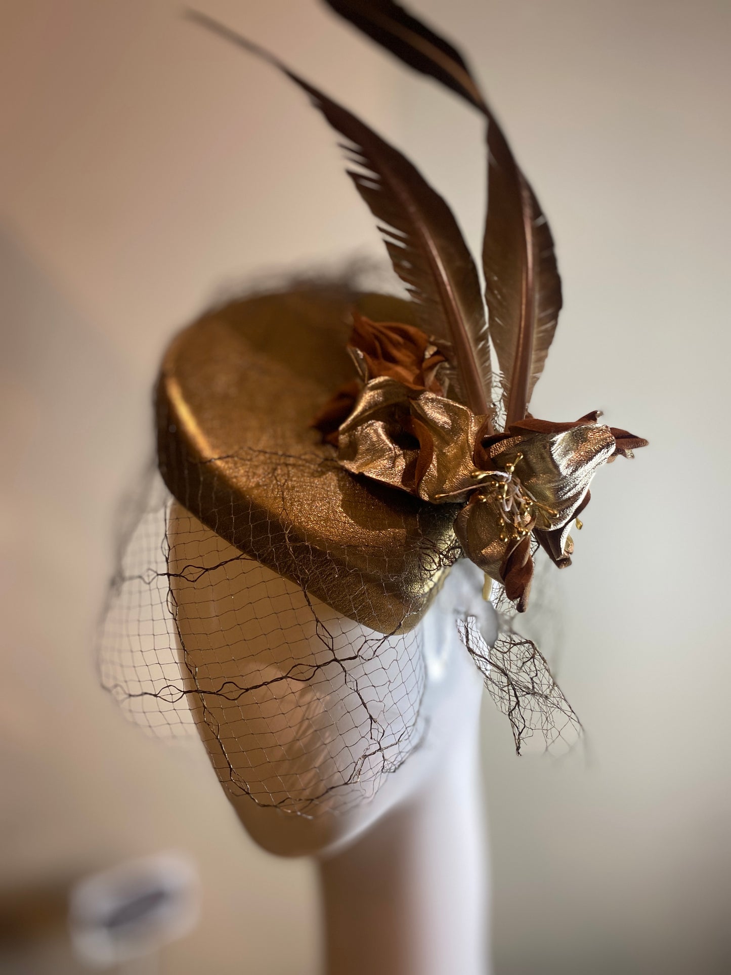 Gold leather percher with feather and vintage veil