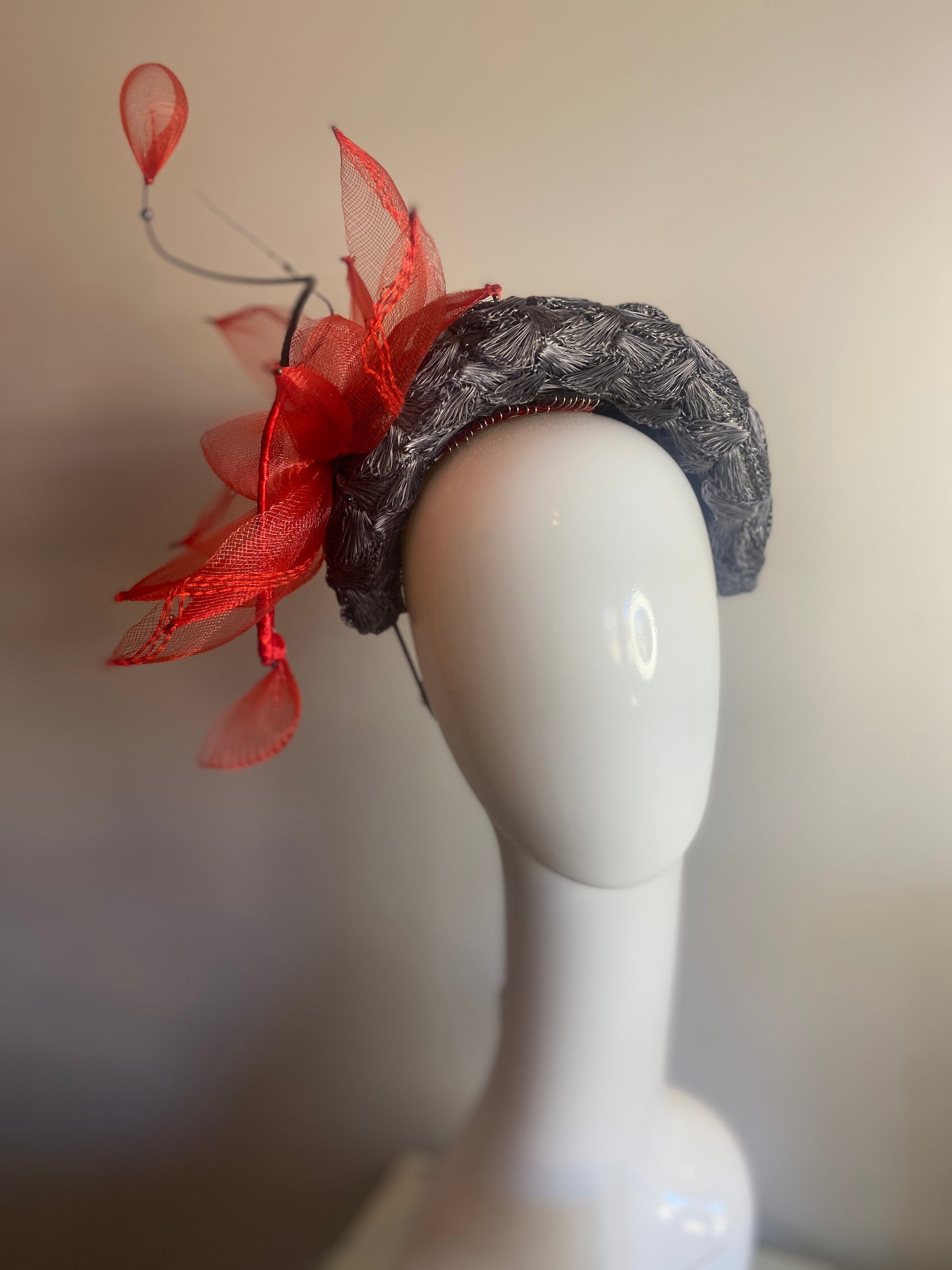 Grey straw bandeau with red flower