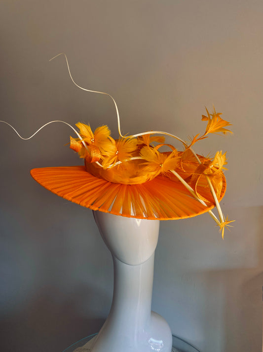 Orange feathered hat with transparent brim