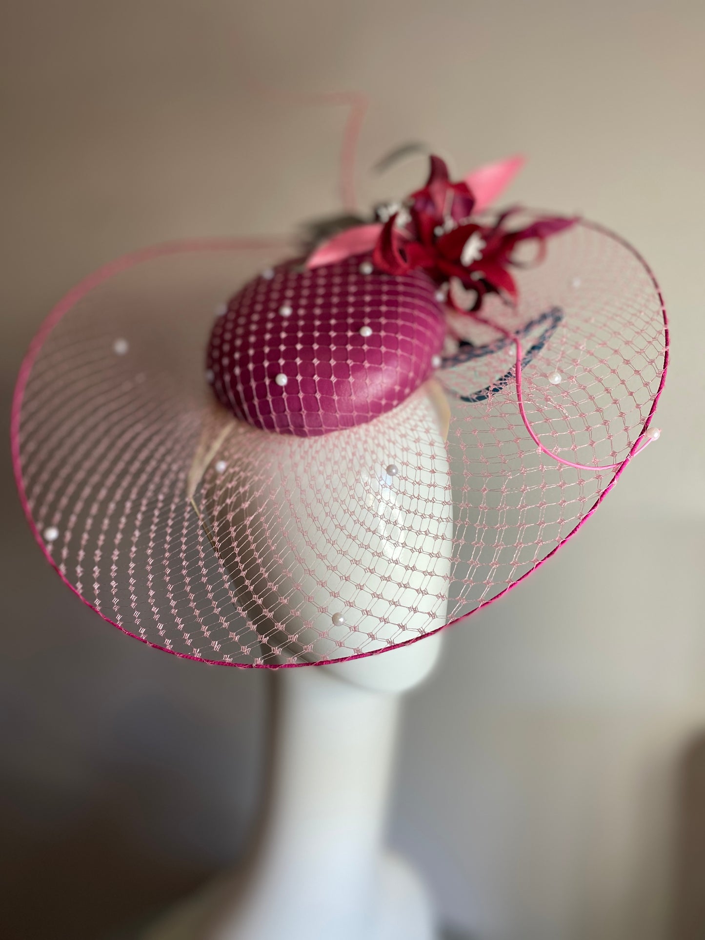 Magenta veiled brim button with leather flowers