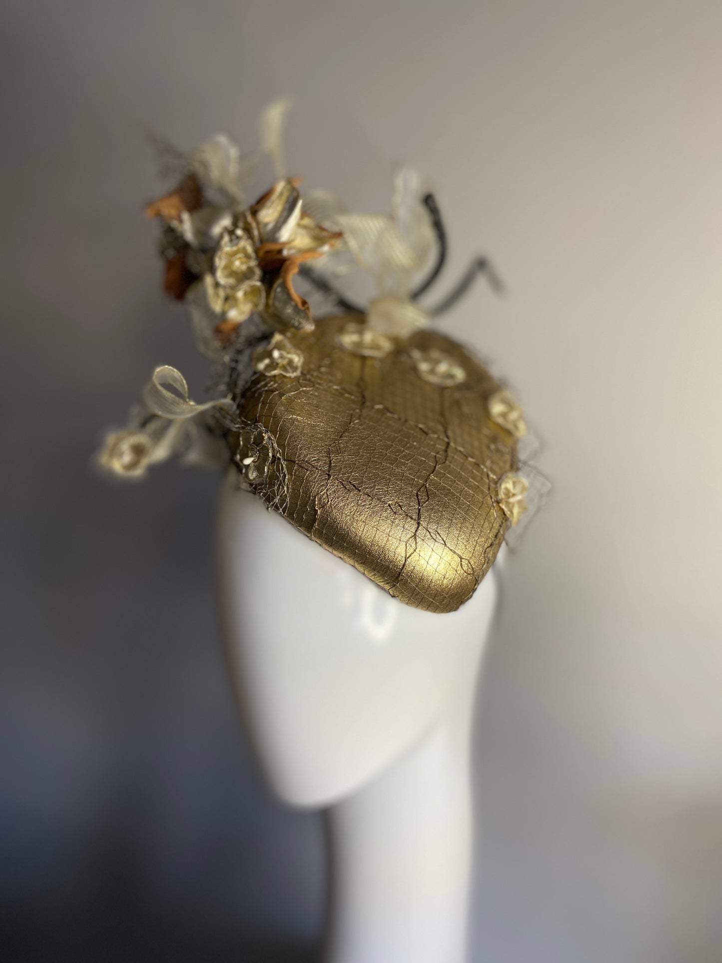 Gold percher with leather flowers