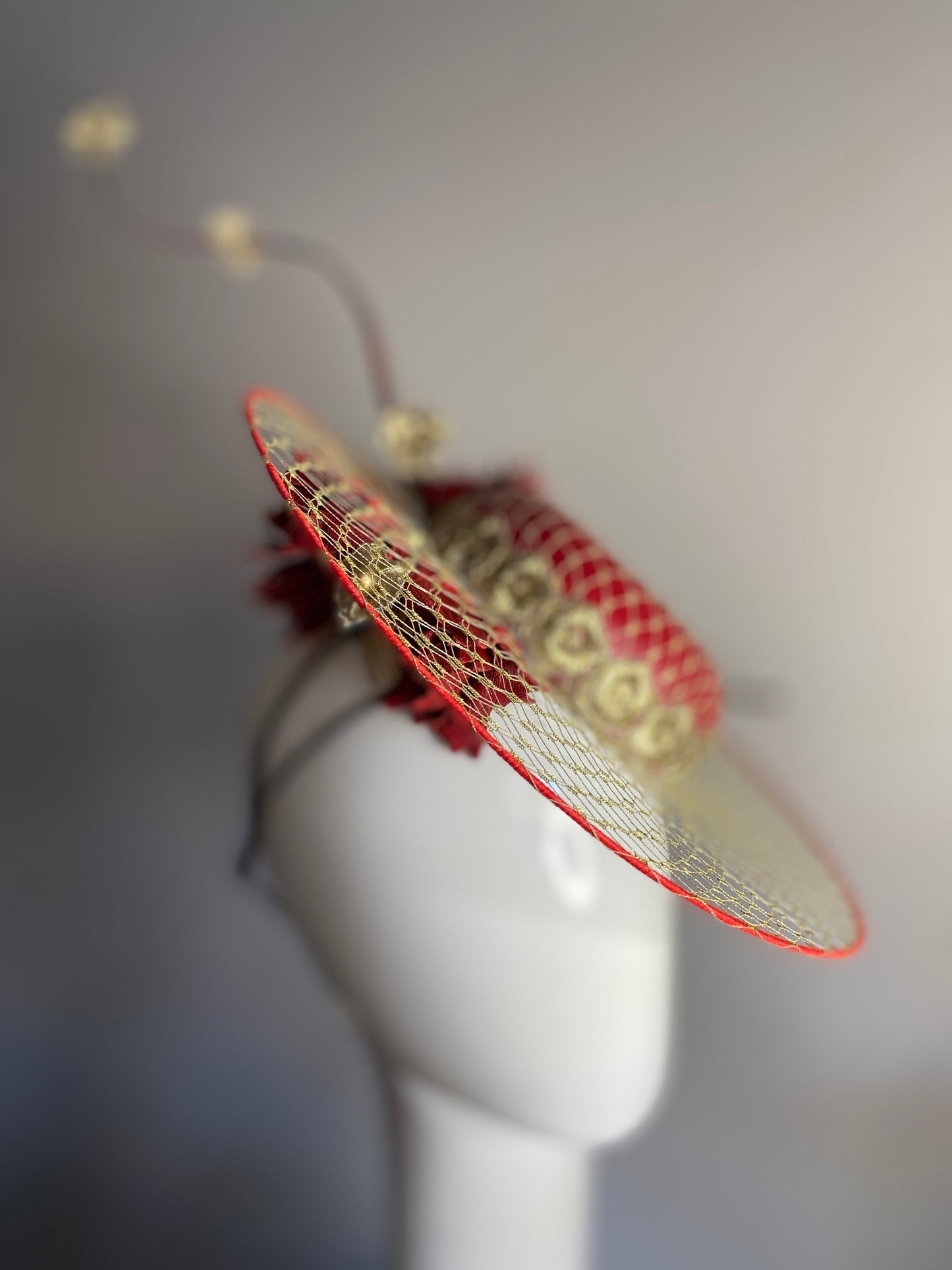 Red leather boater with veil brim